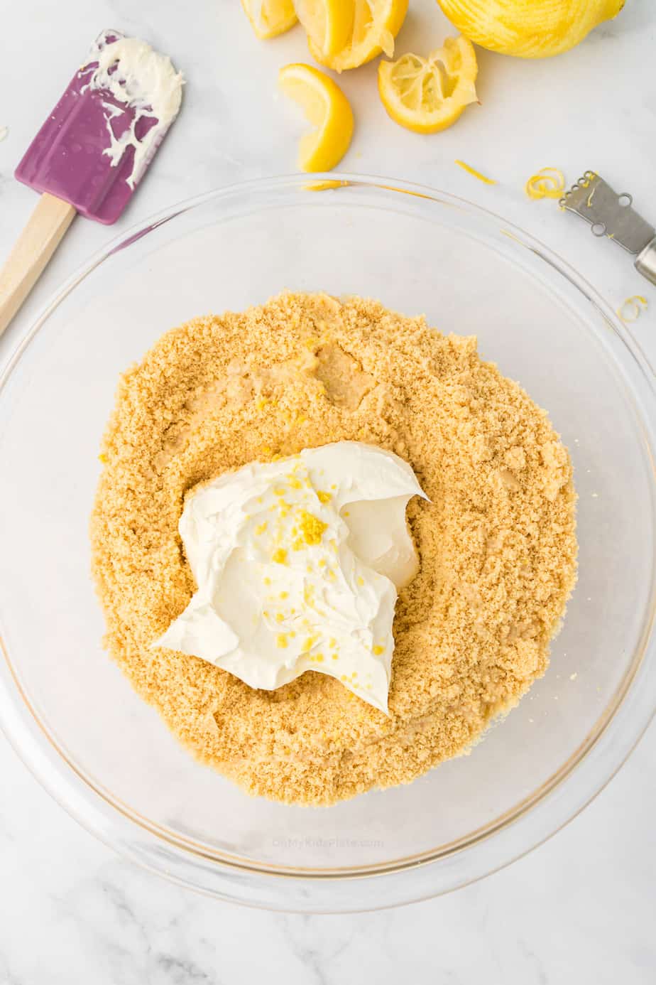 Cream cheese and lemon zest added to cookie crumbs