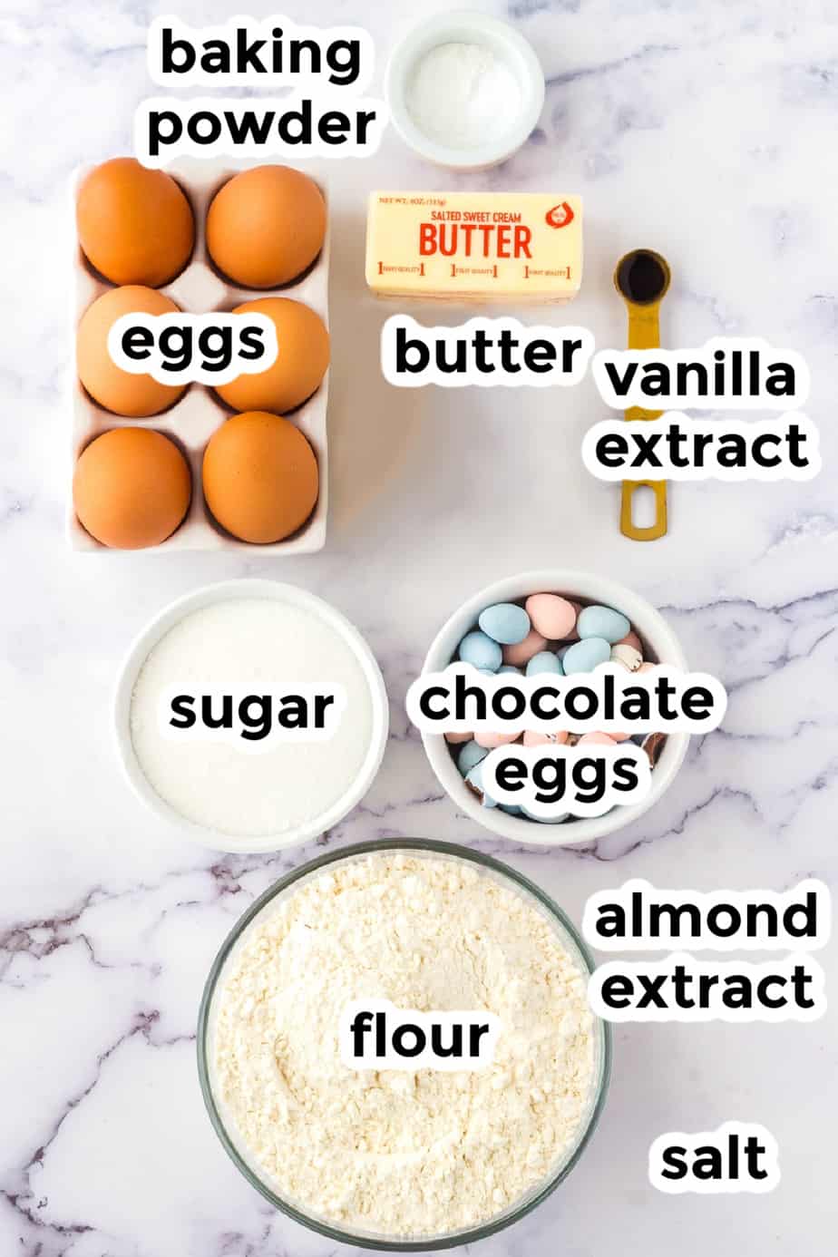Ingredients for chocolate mini egg cookies in bowls with labels from overhead
