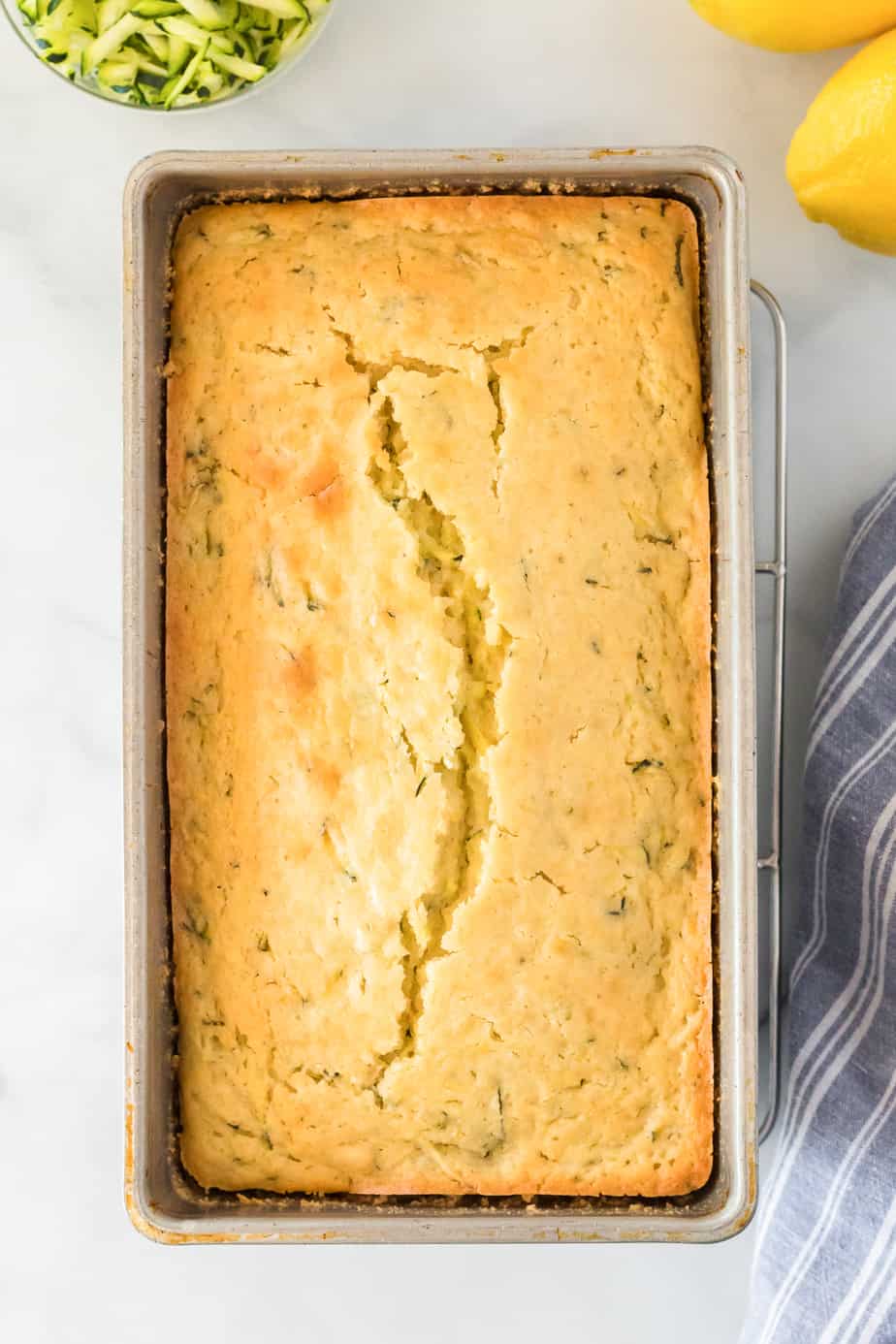 Baked lemon zucchini cake in pan from above