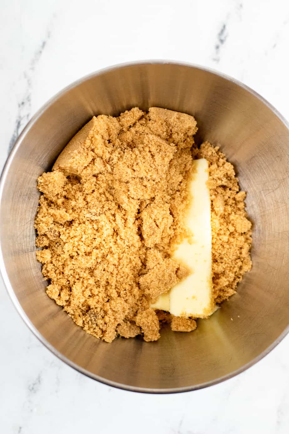 Butter and brown sugar in a mixing bowl to be creamed together from overhead