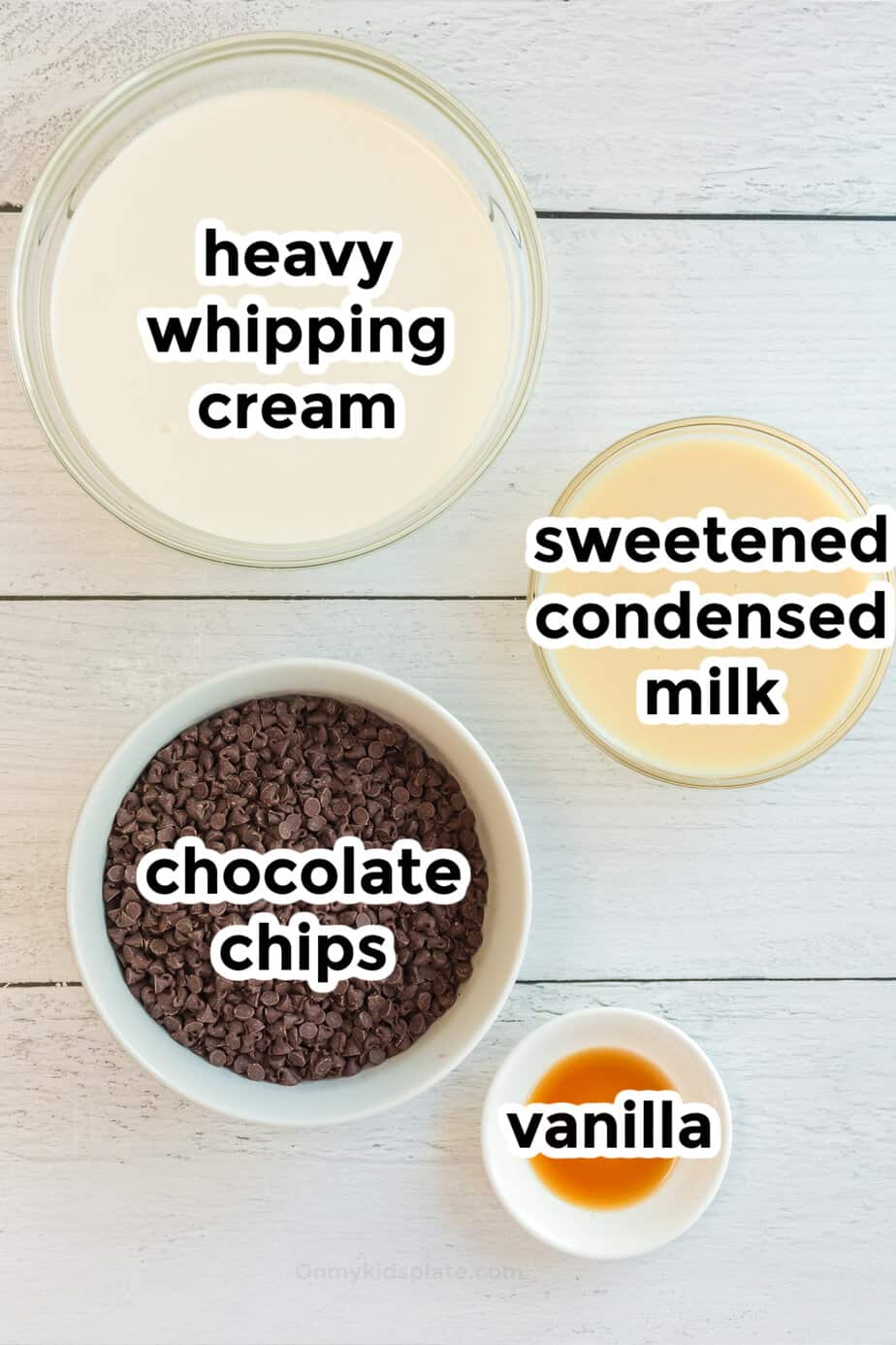 Ingredients for chocolate chip ice cream in bowls from overhead.