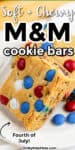 Close up of M&M cookie bars with red white and blue candies. Text title across the top that says "Soft and chewy M&M cookie bars."