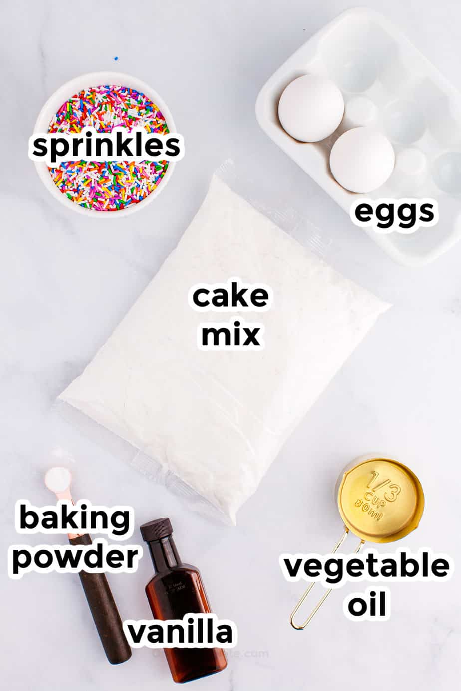 Funfetti cake mix cookie ingredients on a counter with labels.