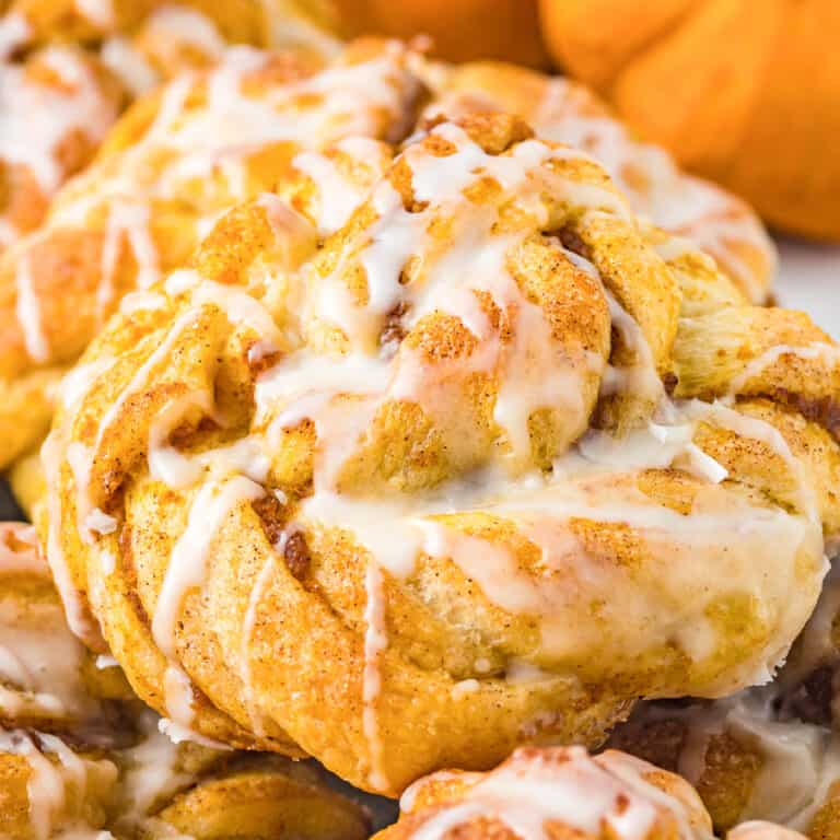 Close up of a pumpkin crescent roll twist pastry up close