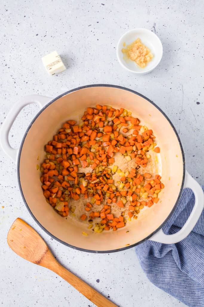 Cooking vegetables in a large pot from overhead.