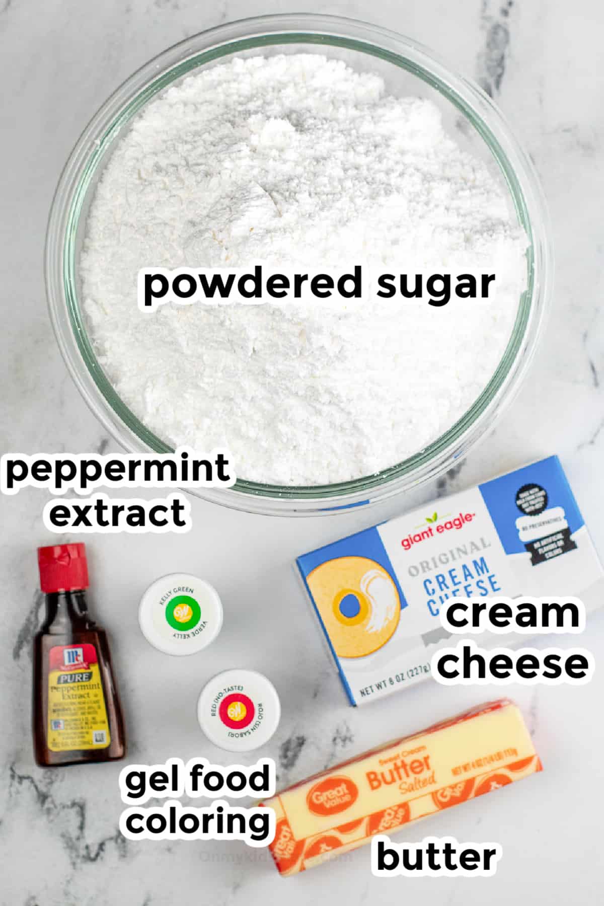 Cream cheese mints ingredients on a counter in bowls from overhead with labels.