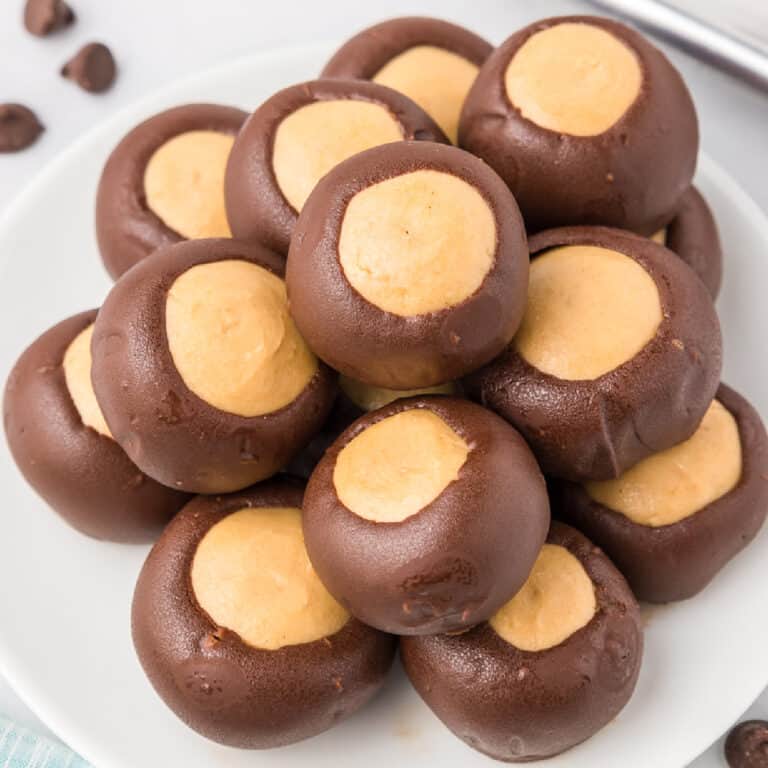 Buckeye candies piled high on a plate from above.