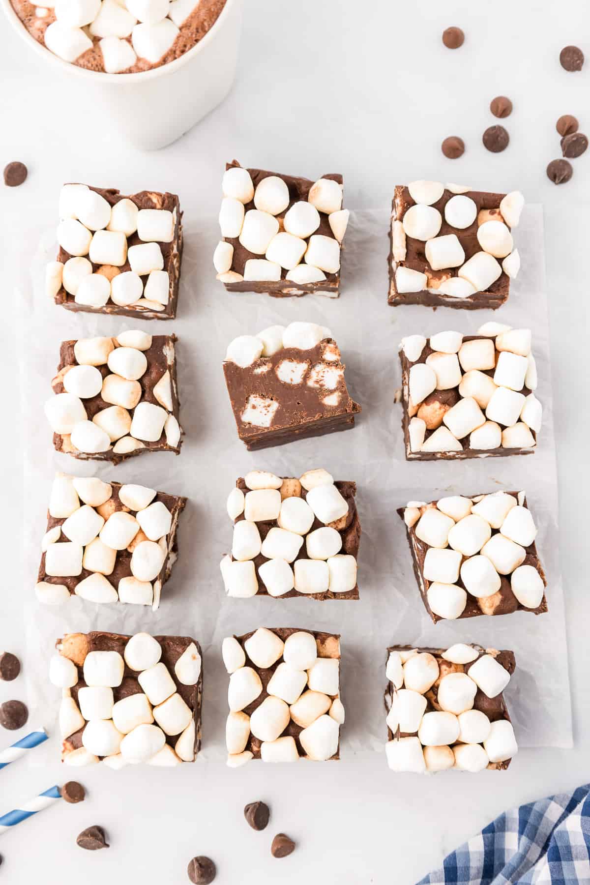Hot chocolate fudge sliced into squares on a counter from overhead spaced out.