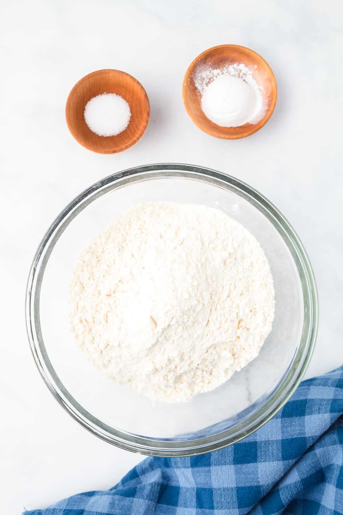 Mixing together flour and other dry ingredients for cranberry orange bread.