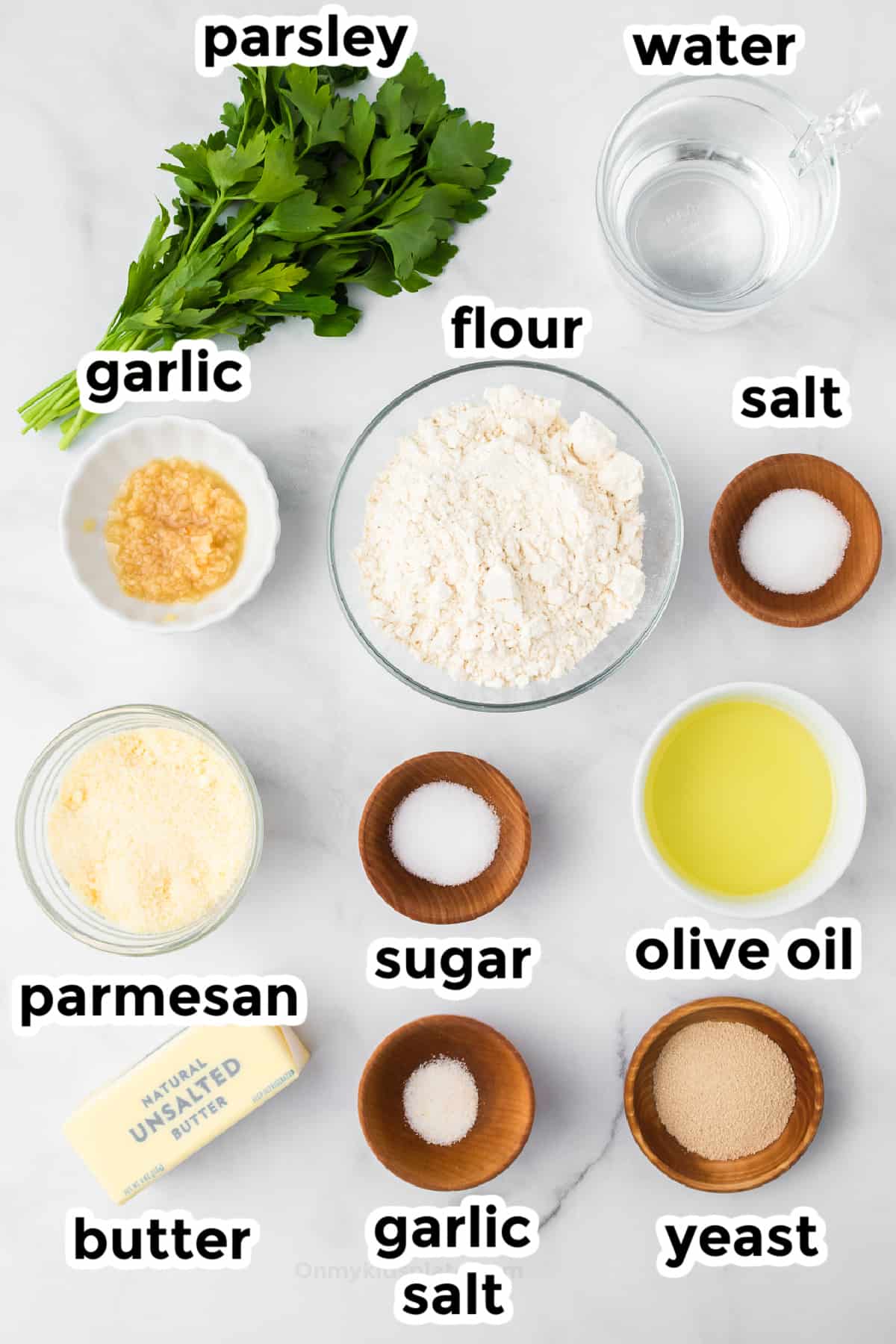 Garlic knot ingredients in bowls on a counter with title text labels.