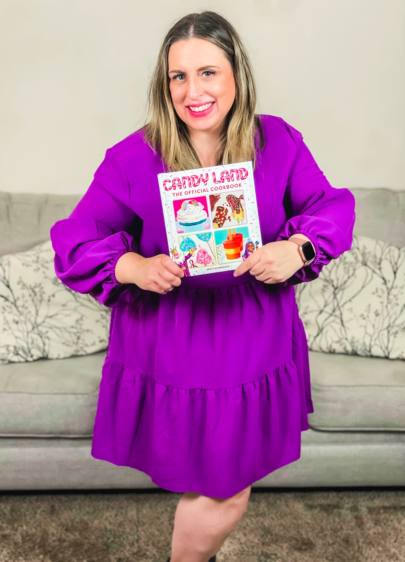 Kristy Richardson holding the new official Candy Land cookbook.
