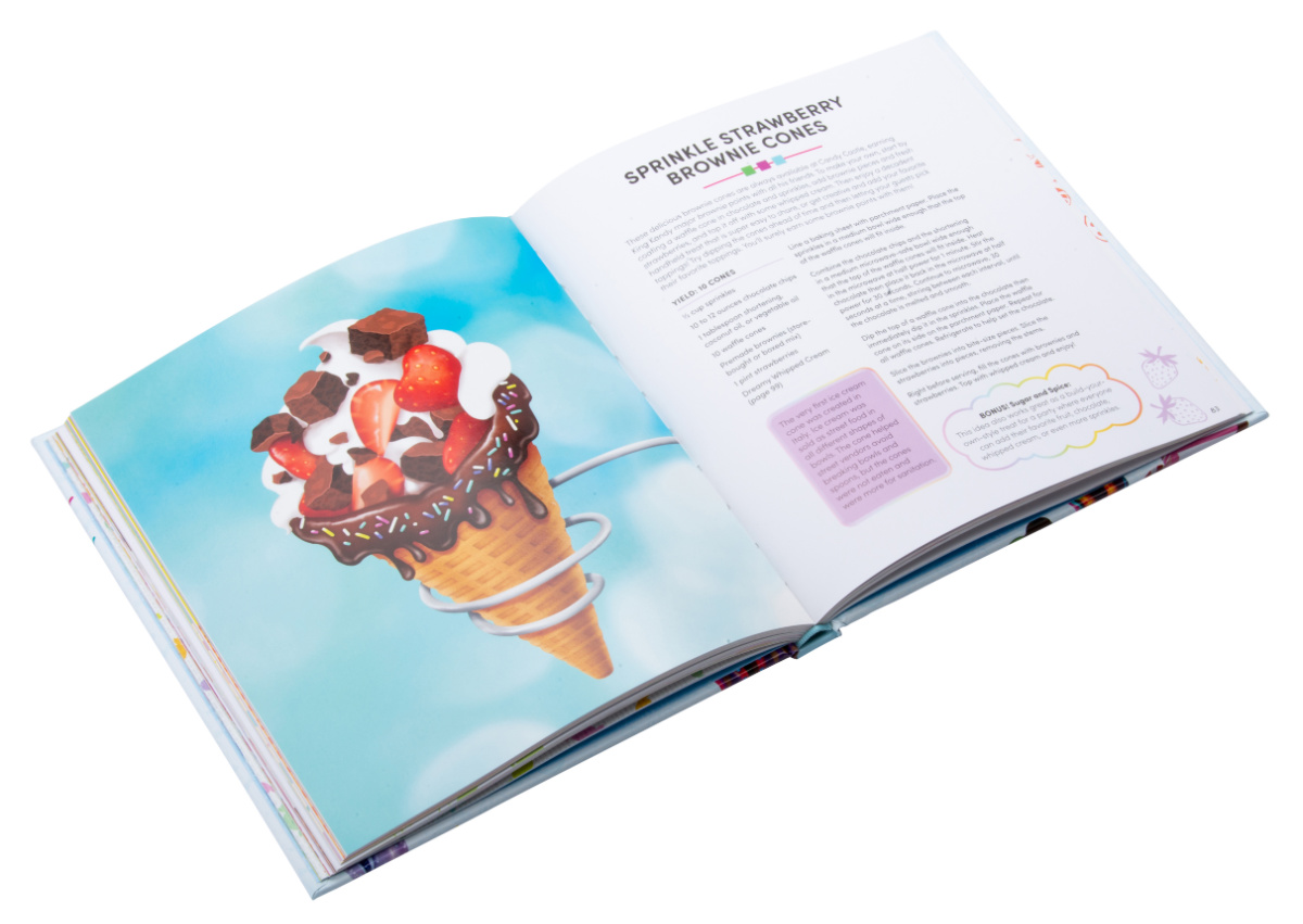 Candy Land Cookbook open to a page featuring brownie, chocolate and strawberry filled ice cream cones.