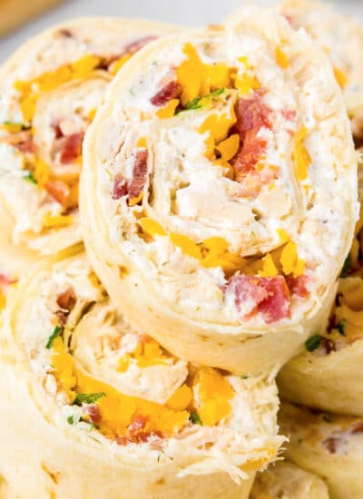 Close up focus on a chicken bacon ranch pinwheel at the top of a stack.