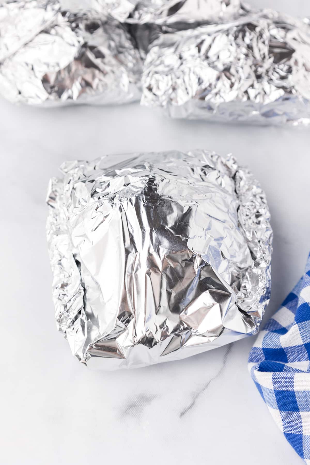 Foil wrapped packets close up showing how they are folded.