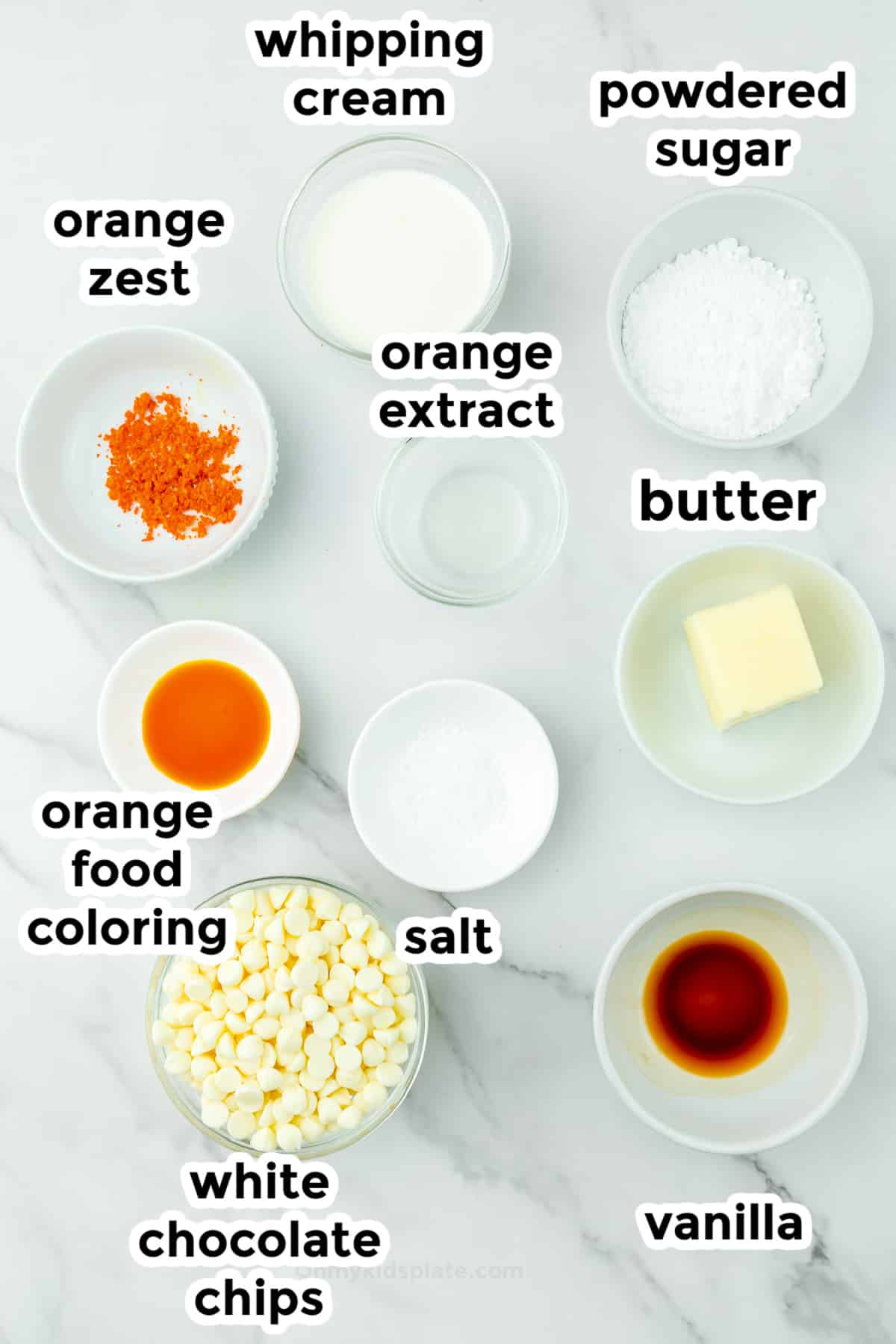 Ingredient for orange creamsicle truffles in bowls on a counter from overhead with title text overlays.