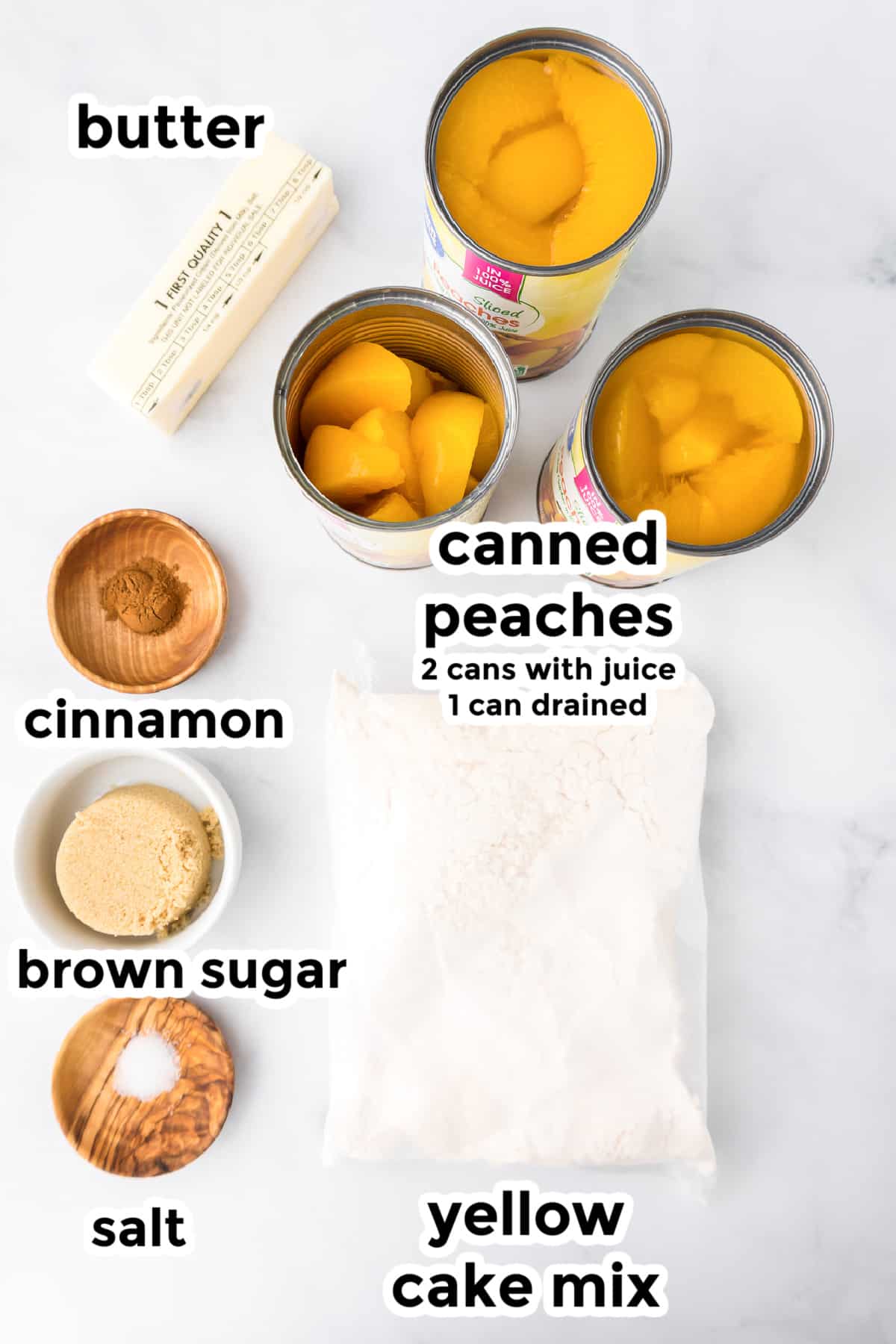 Ingredients for peach dump cake in bowls on a counter from overhead with text labels on the ingredients.