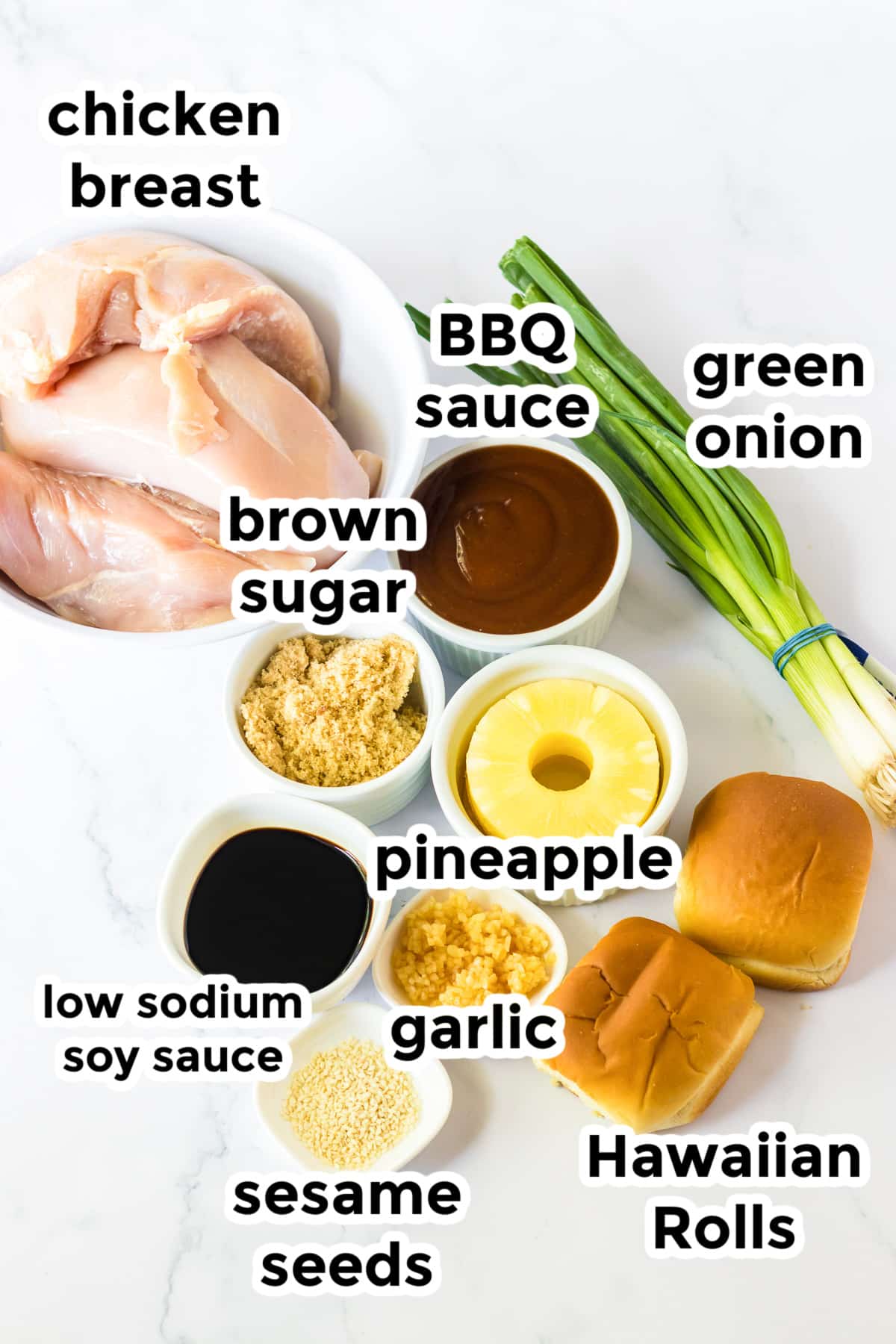 Ingredients for slow cooker hawaiian roll chicken sliders in bowls on a counter with text labels from above.