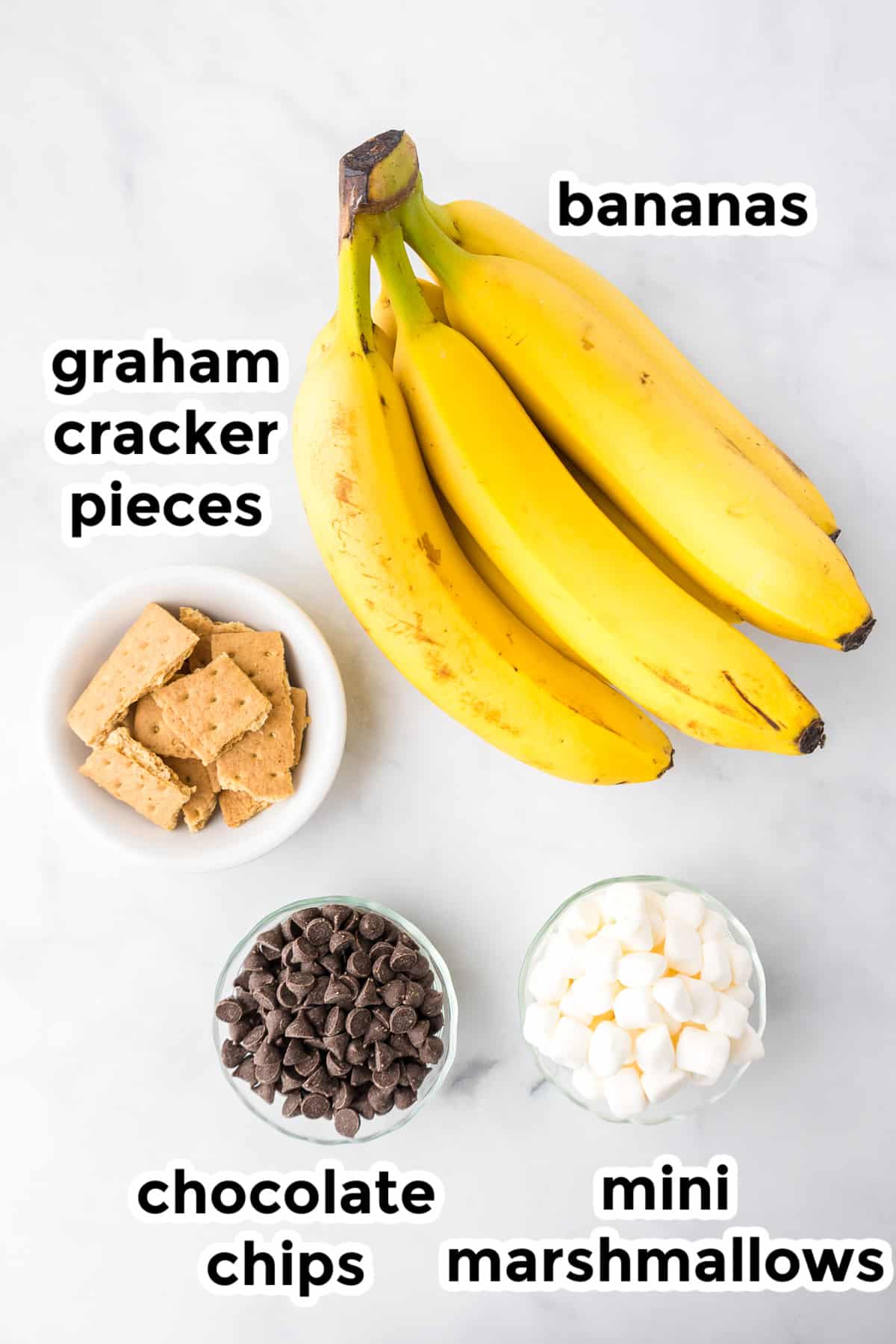 Ingredients for banana boats on a counter with text title labels.