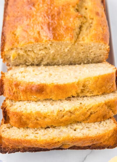 Pineapple banana bread sliced into thick slices from a loaf from above.