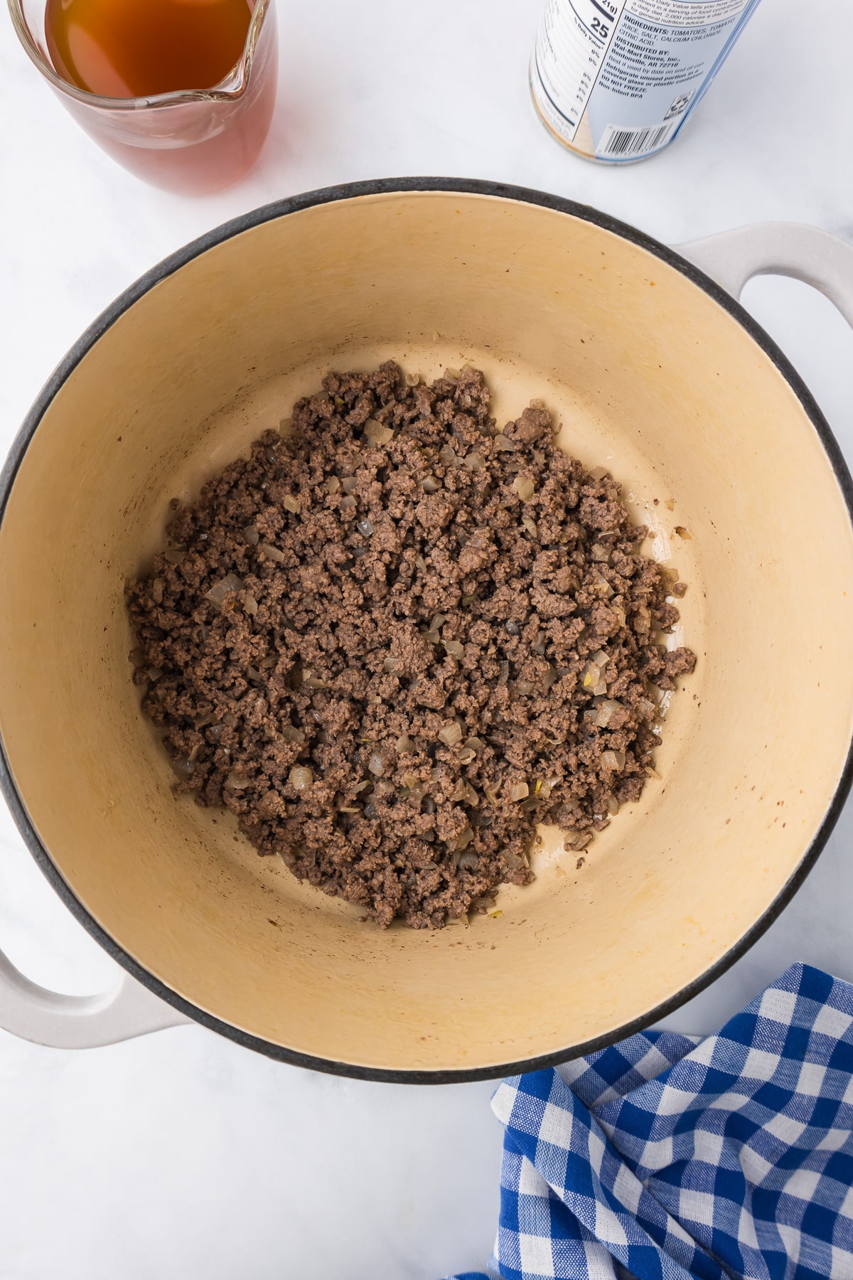 Ground beef cooked in a large pot from overhead.