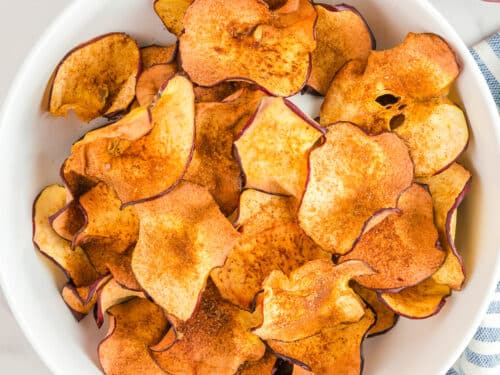 Bowl of crispy cinnamon apple chips as healthy snack