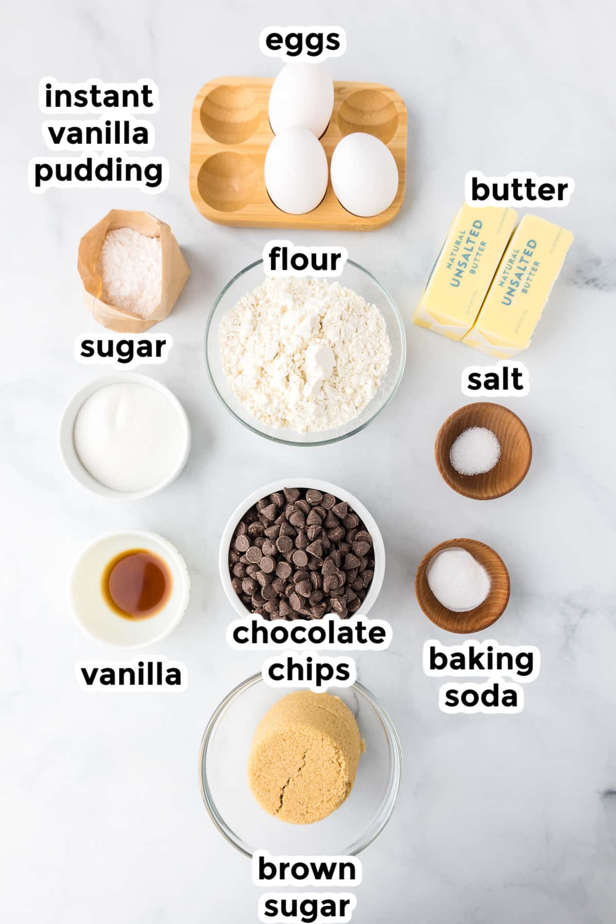 Ingredients for chocolate chip pudding cookies on a counter with title text labels.