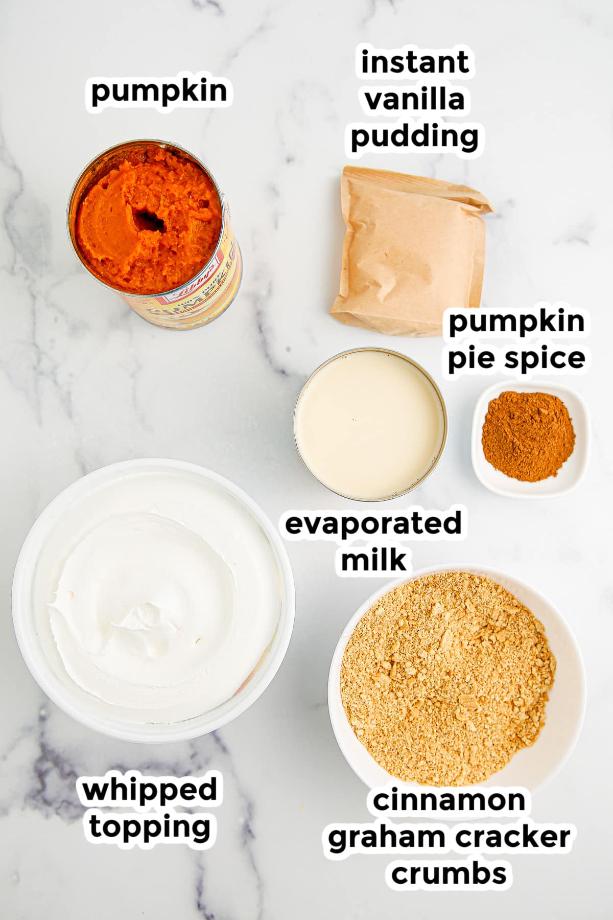 Pumpkin pie pudding ingredients on a marble countertop in bowls with title text overlays.