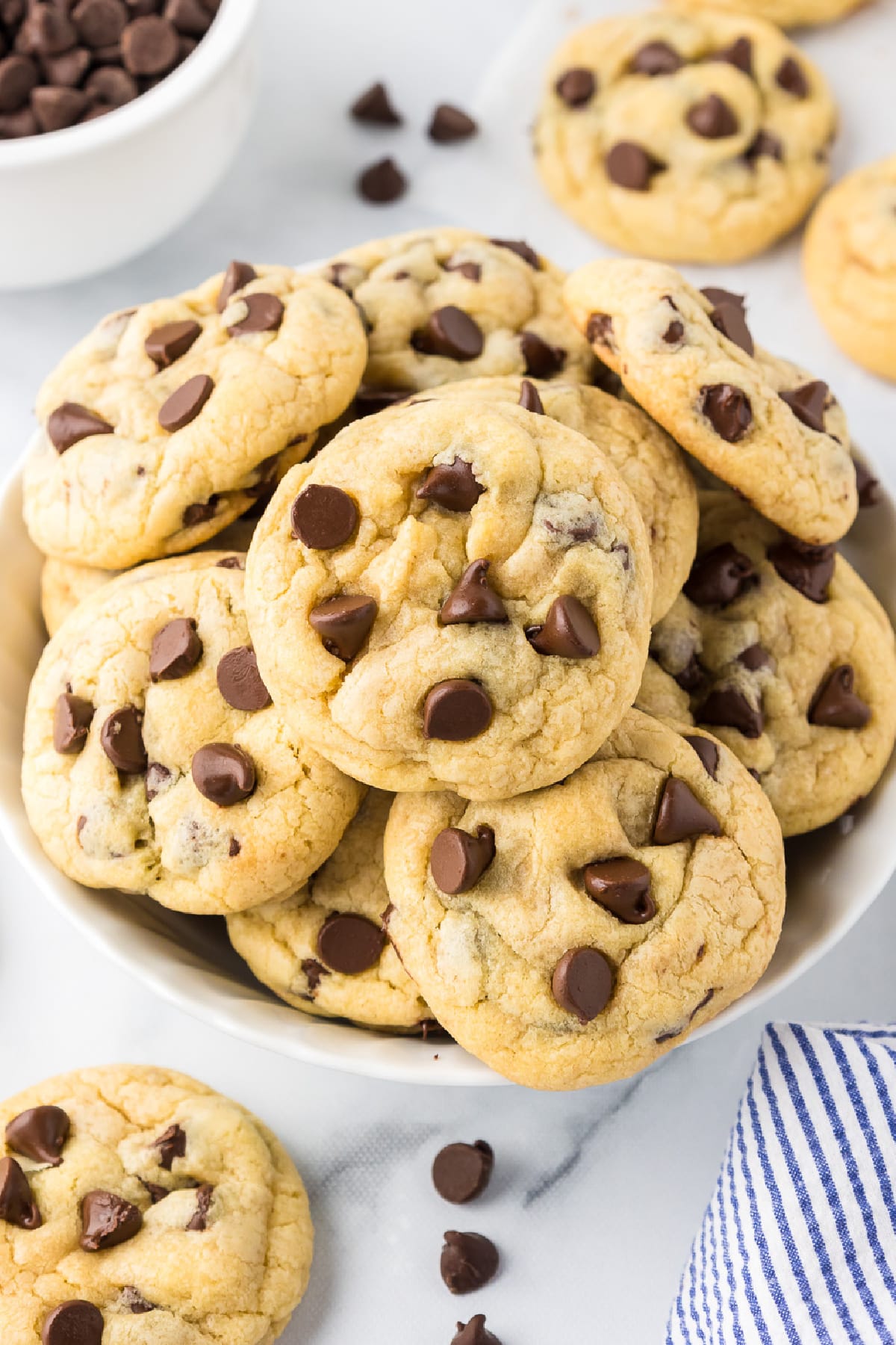 Chocolate chip pudding cookies from overhead stacked in a bowl.