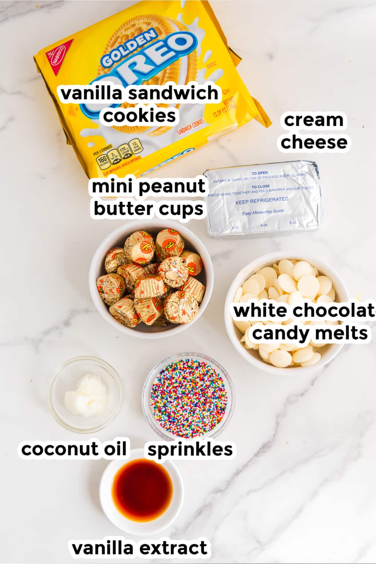 The ingredients for peanut butter cup stuffed truffles on a counter in bowls with text labels.