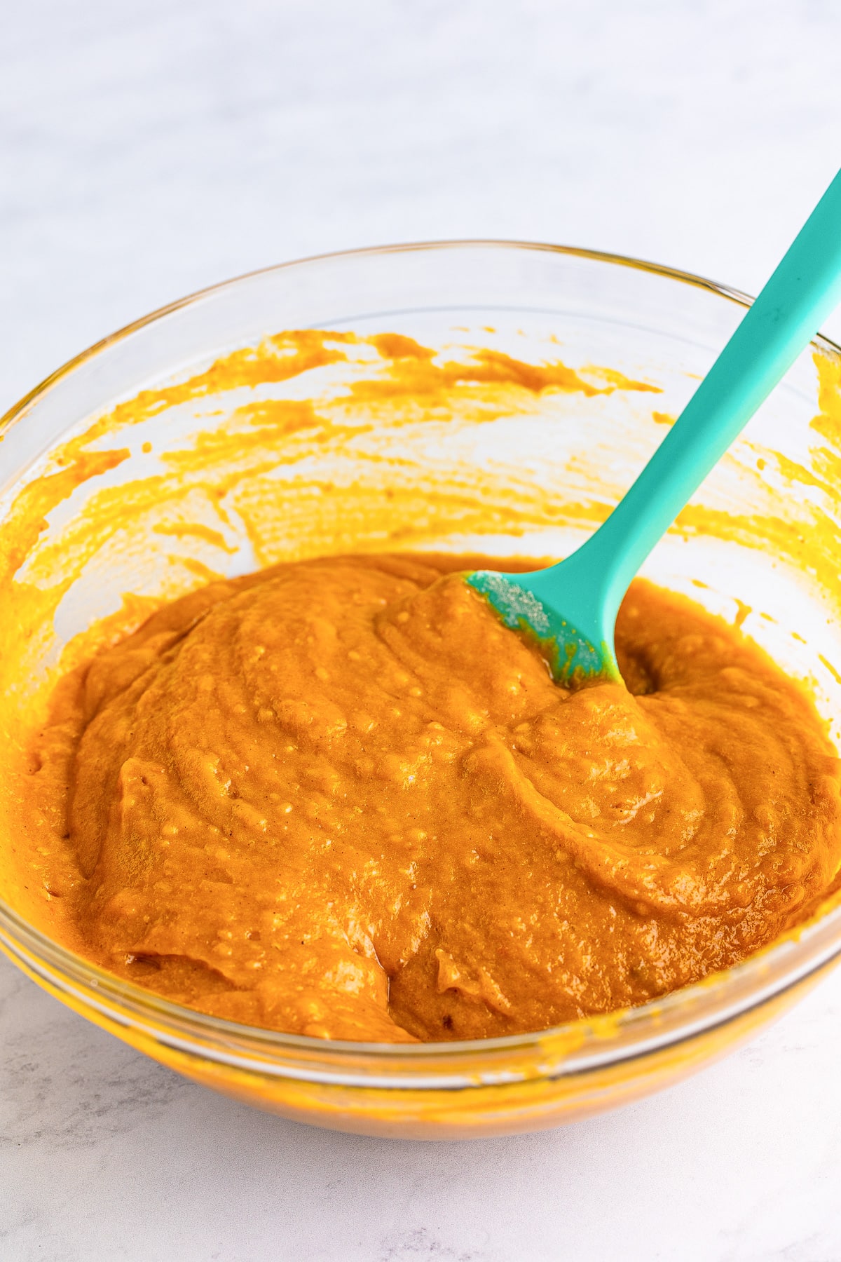 Pumpkin cake batter after all ingredients are mixed in a bowl.
