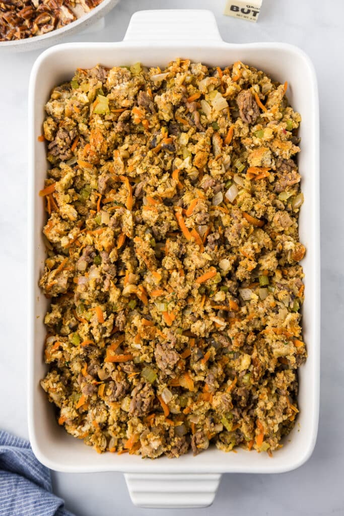 A rectangular casserole dish filled with stuffing.