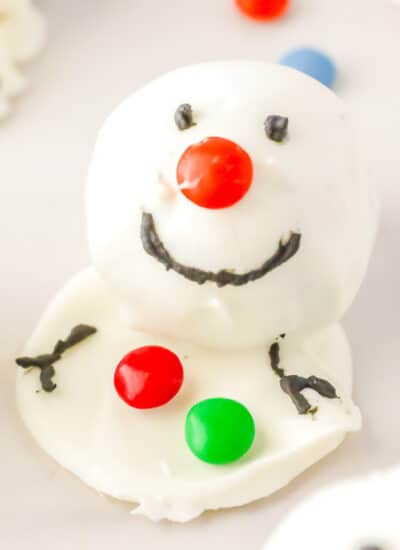 Snowman Oreo ball decorated with candy close up.