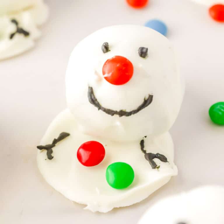 Snowman Oreo ball decorated with candy close up.