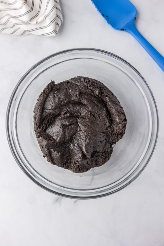 A Oreo mint chocolate truffle dough in a large bowl from above.