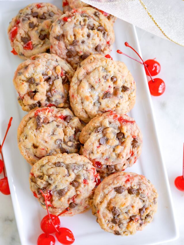 Chocolate chip cherry cookies on a white plate.