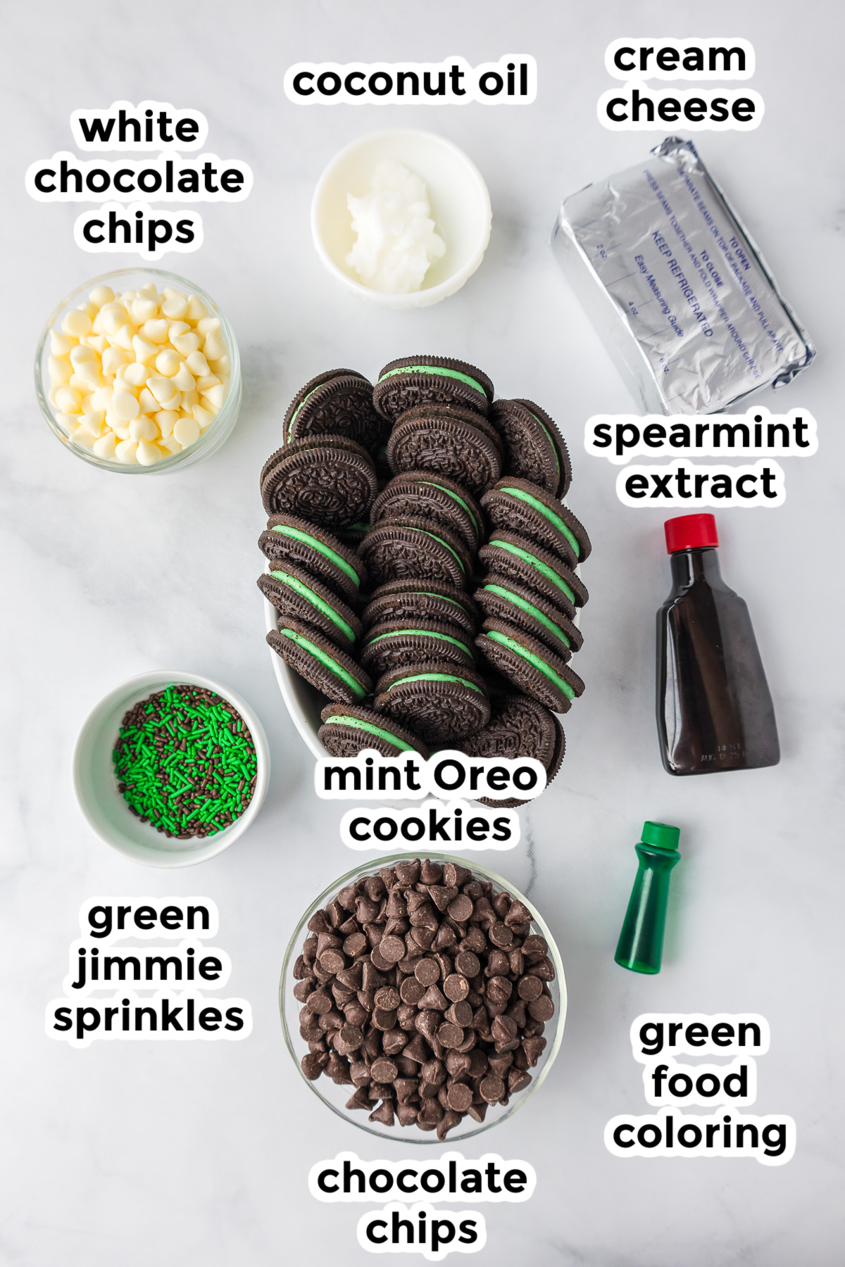 Ingredients for mint oreo balls in bowls on a counter from above.