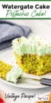 Tall image of pistachio cake also called Watergate cake with a bite missing and title text overlay.