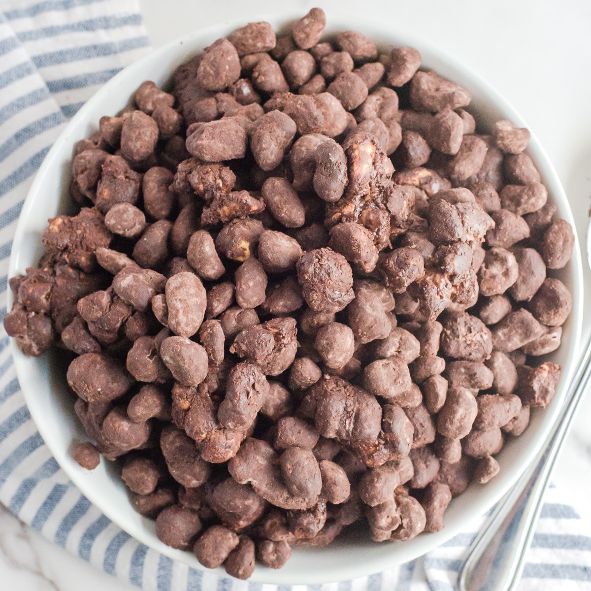 A bowl of chocolate reindeer poop snack mix.