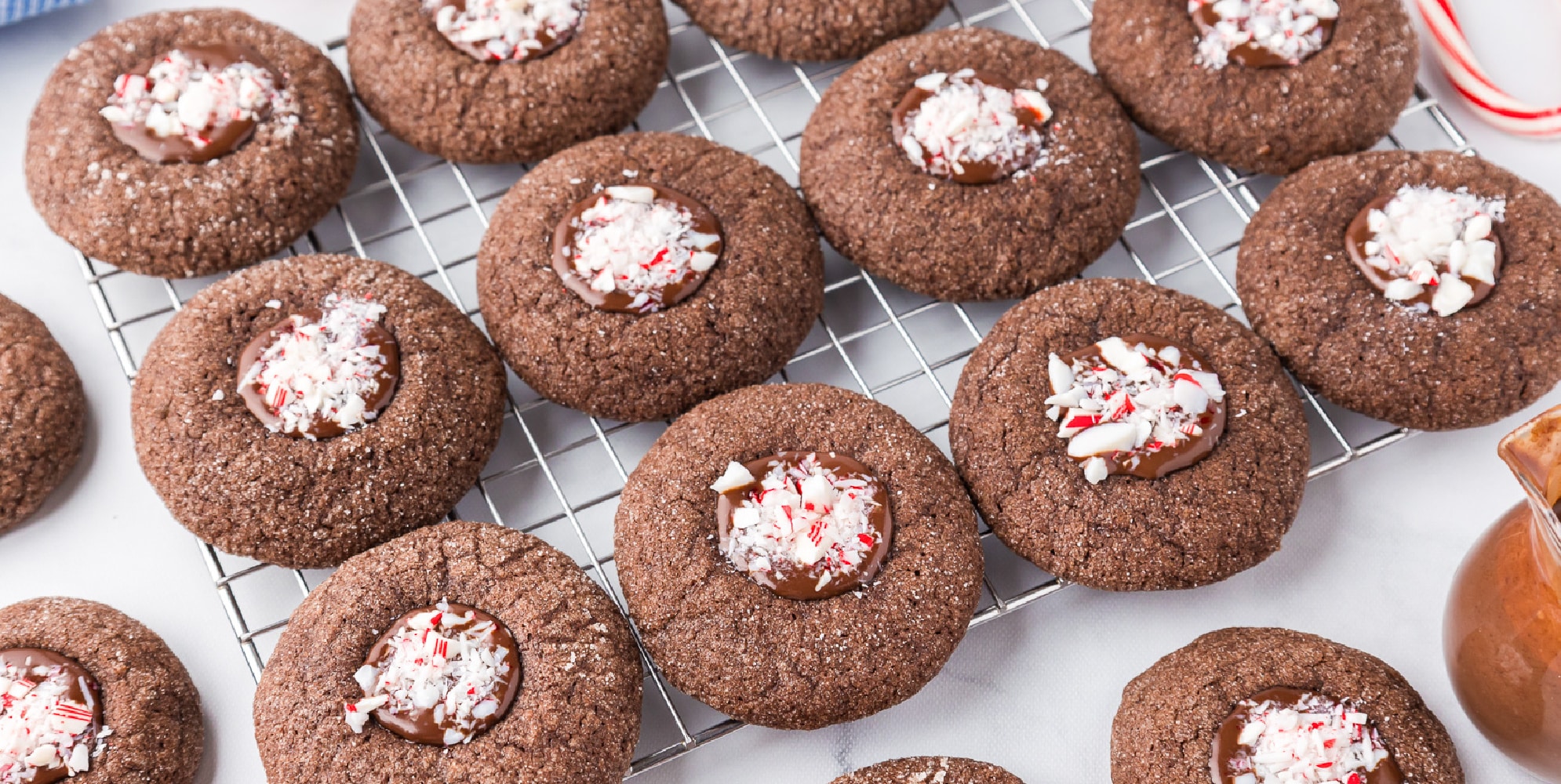 Chocolate peppermint cookies on a cooling rack lined up.