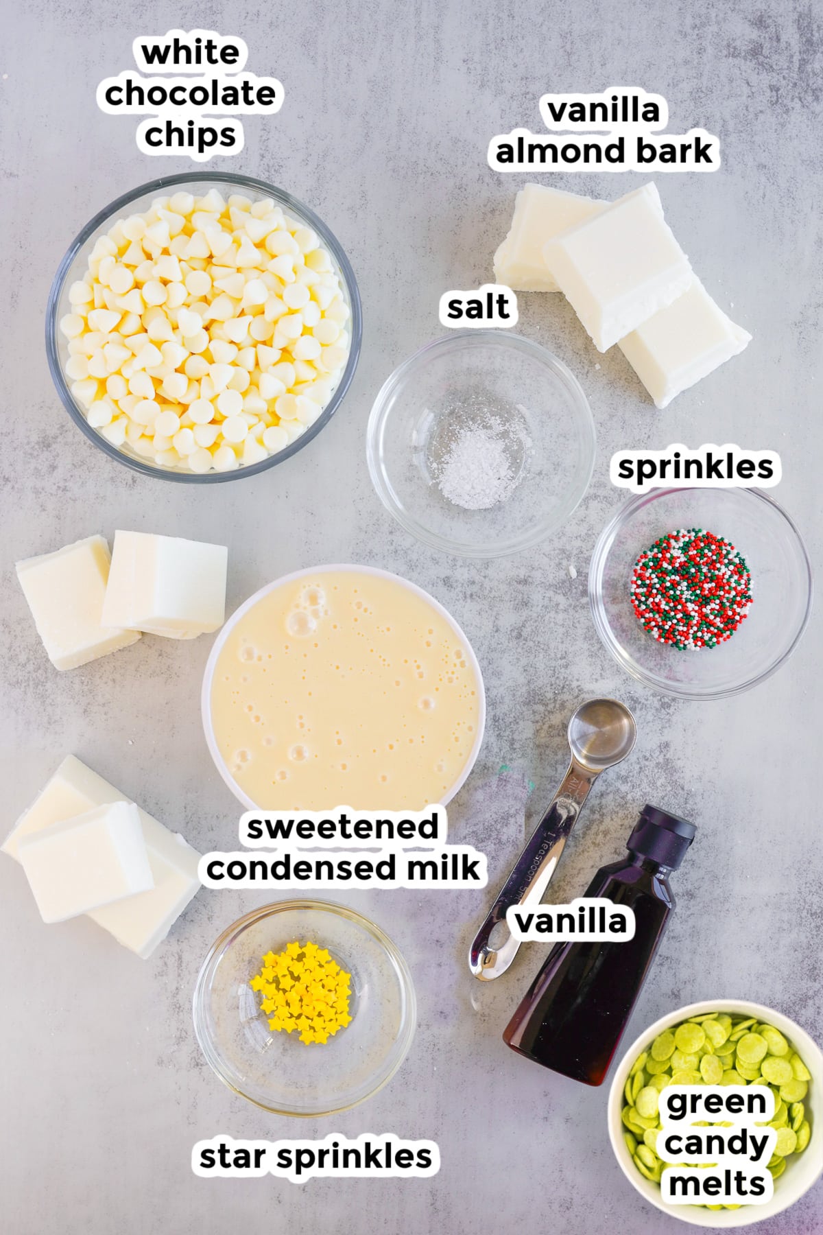 Ingredients for a vanilla fudge on a counter in bowls with text labels.