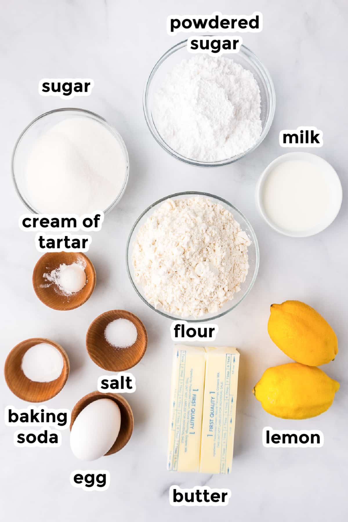 Ingredients for lemon cookies on a counter in bowls with title text overlays.