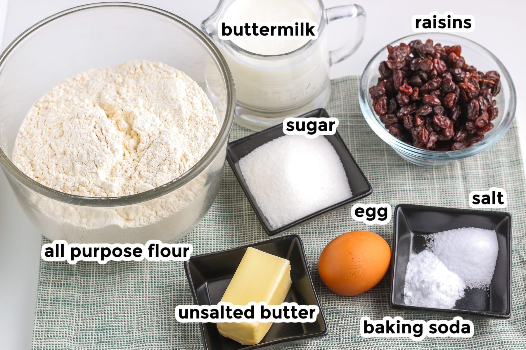 Ingredients for Irish soda bread in bowls with text titles.