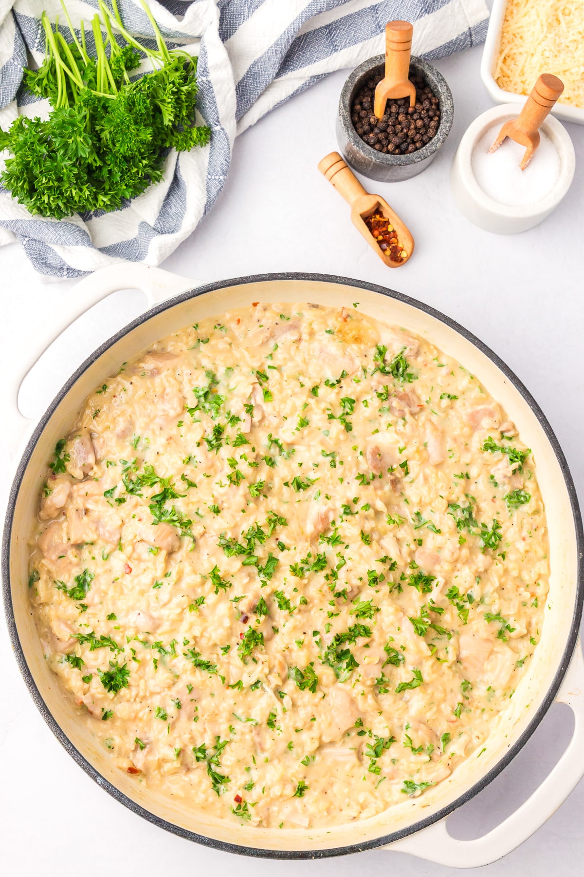 Creamy chicken and rice in a pan after cooking.