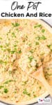 One pot creamy chicken and rice with a wooden spoon and title text across the top.