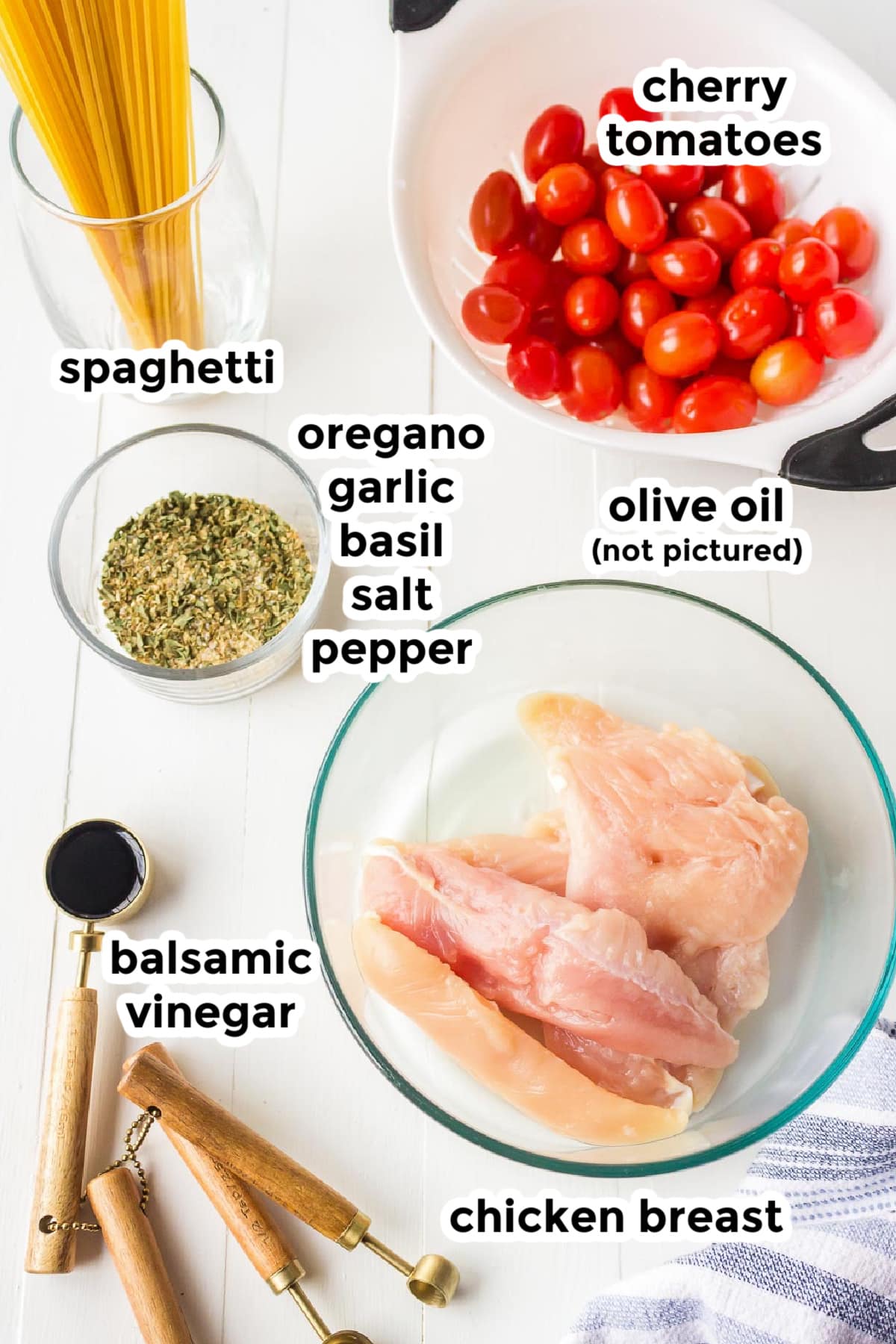 Overhead view of ingredients for chicken bruschetta pasta in bowls with text labels.