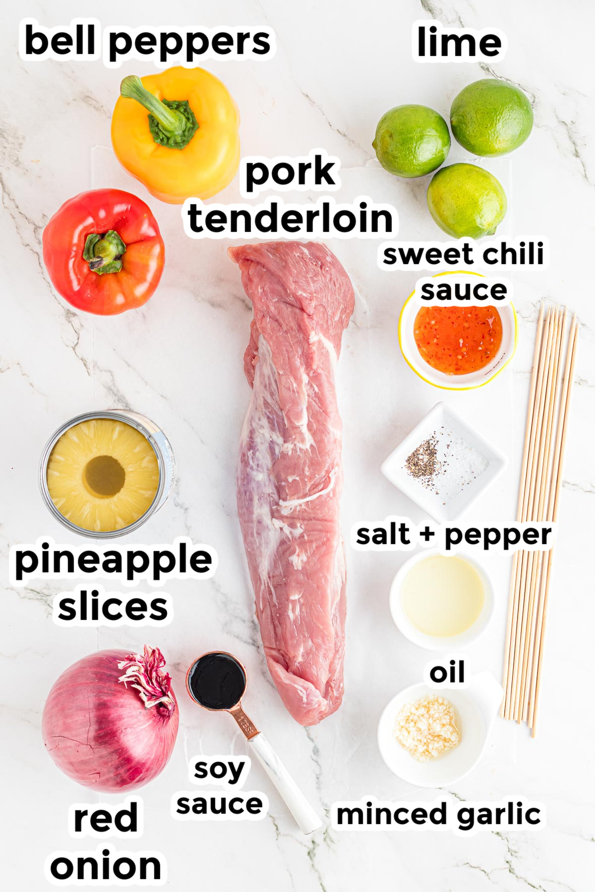 Ingredients for a pineapple pork skewers with pork tenderloin, bell peppers, lime, sweet chili sauce, pineapple slices, onion, soy sauce, minced garlic, oil, salt, and pepper, neatly arranged in bowls with text labels.