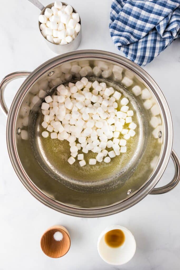 A large pot filled with melting butter and mini marshmallows.