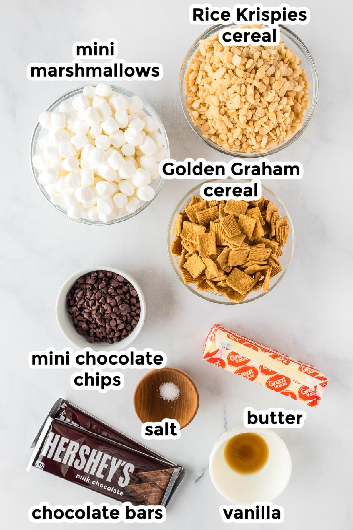 Ingredients for s'mores Rice Krispies treats in bowls on a counter with title text labels.