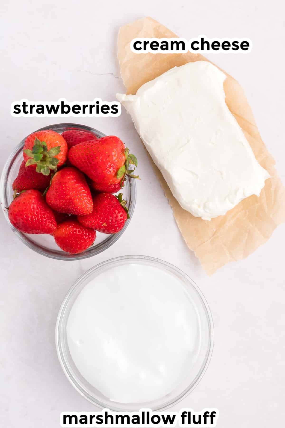 Ingredients for cream cheese fruit dip on a counter with text labels.