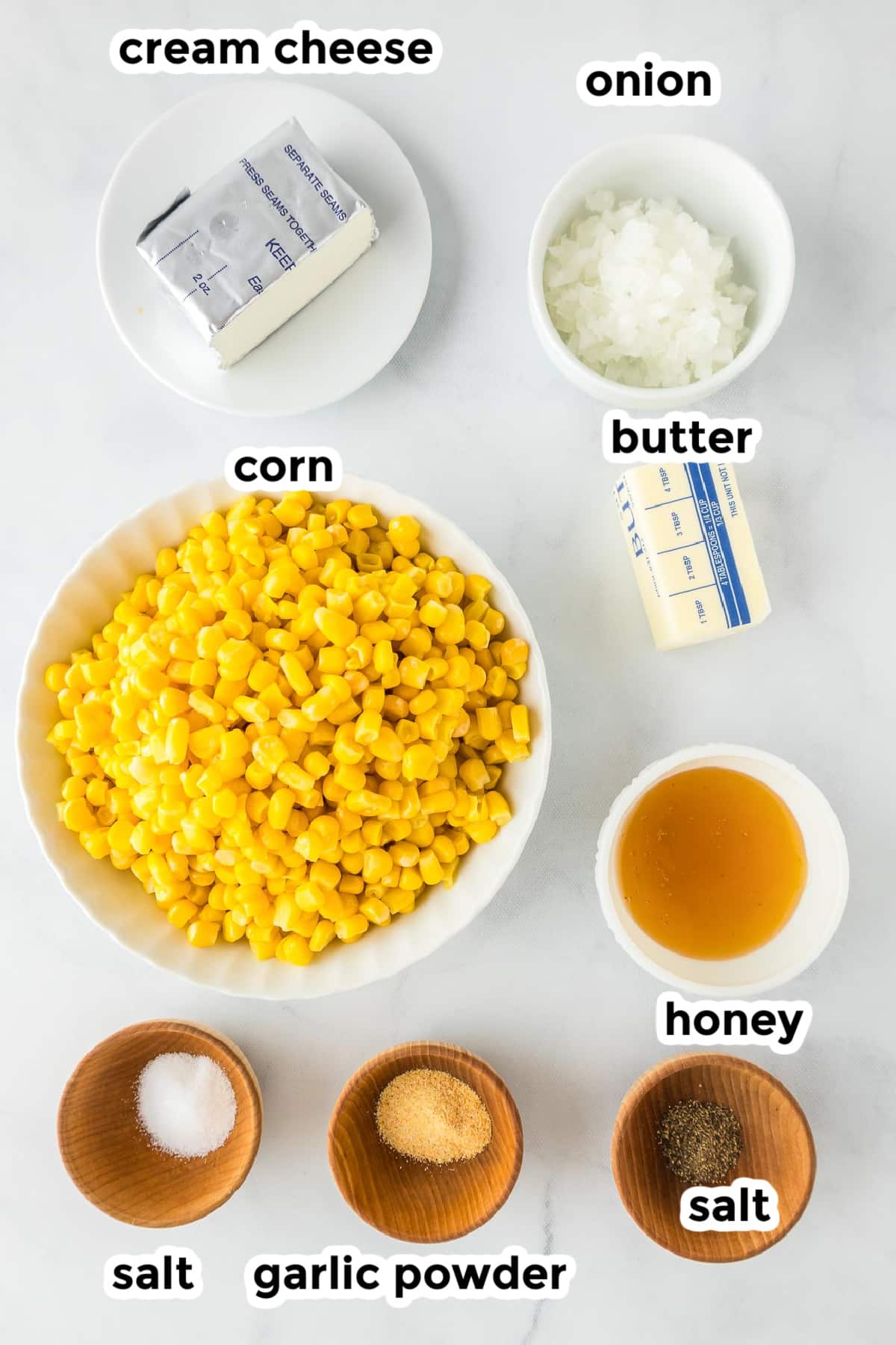 Ingredients for skillet honey butter corn in bowls from overhead with text labels.